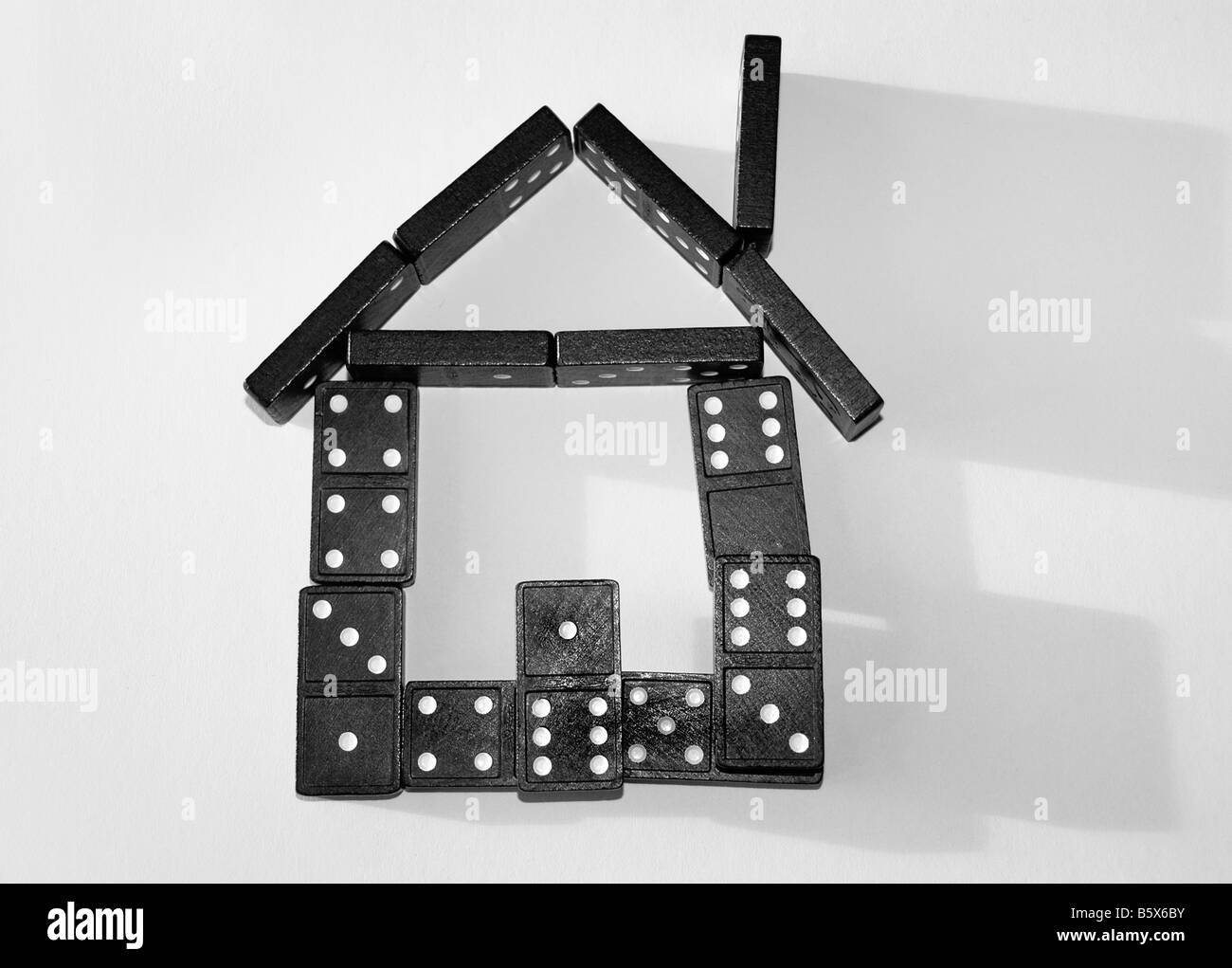 a house shaped by dominoes. Stock Photo