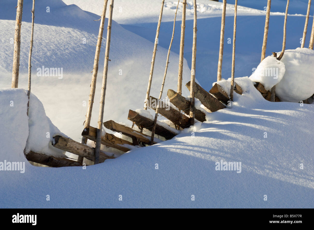 Traditional Norwegian skigard fence in deep snow Valdres Norway Stock Photo