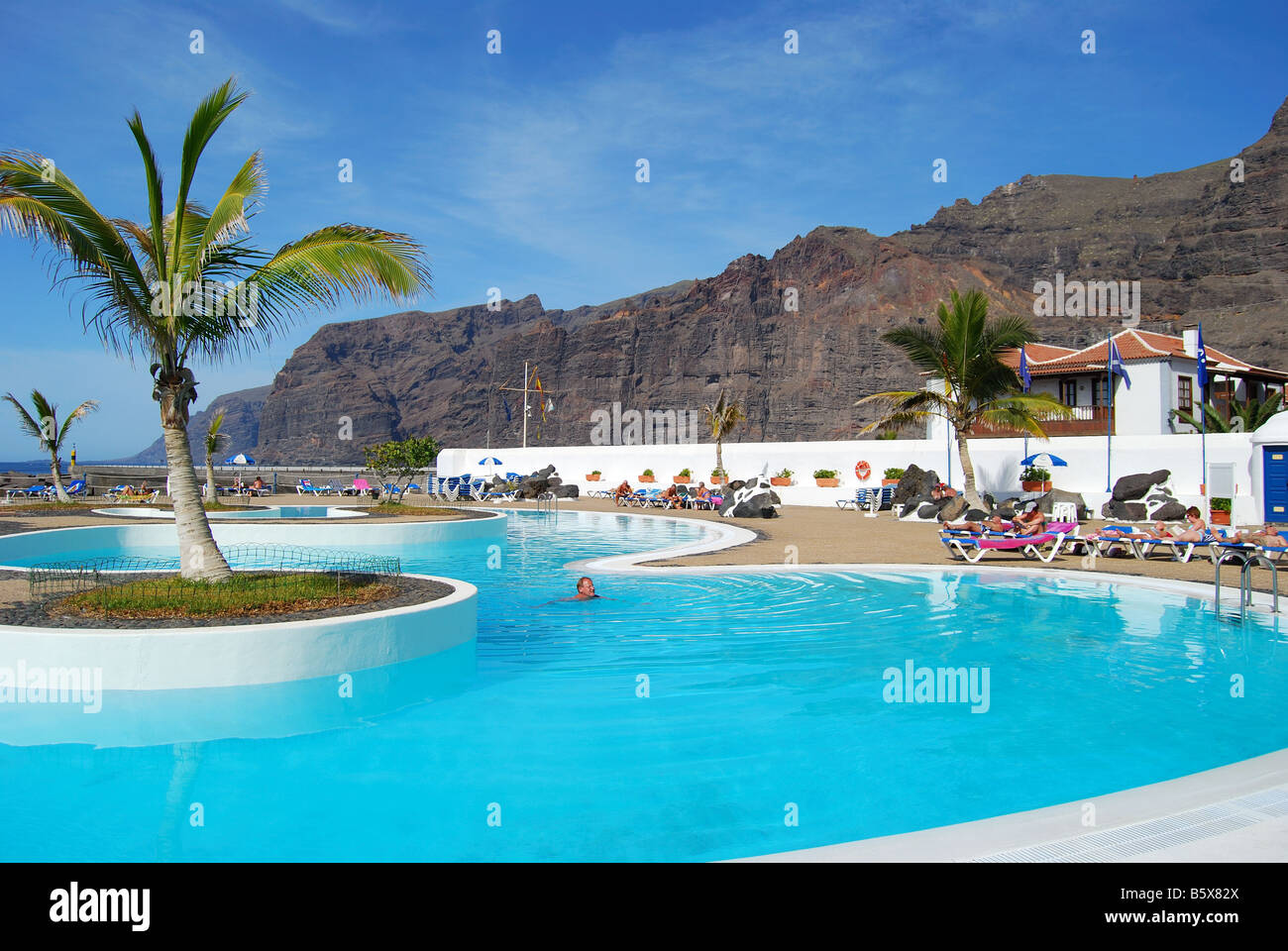 Lido pool showing Acantilados de Los Gigantes, Santiago del Teide, Tenerife, Canary Islands, Spain Stock Photo