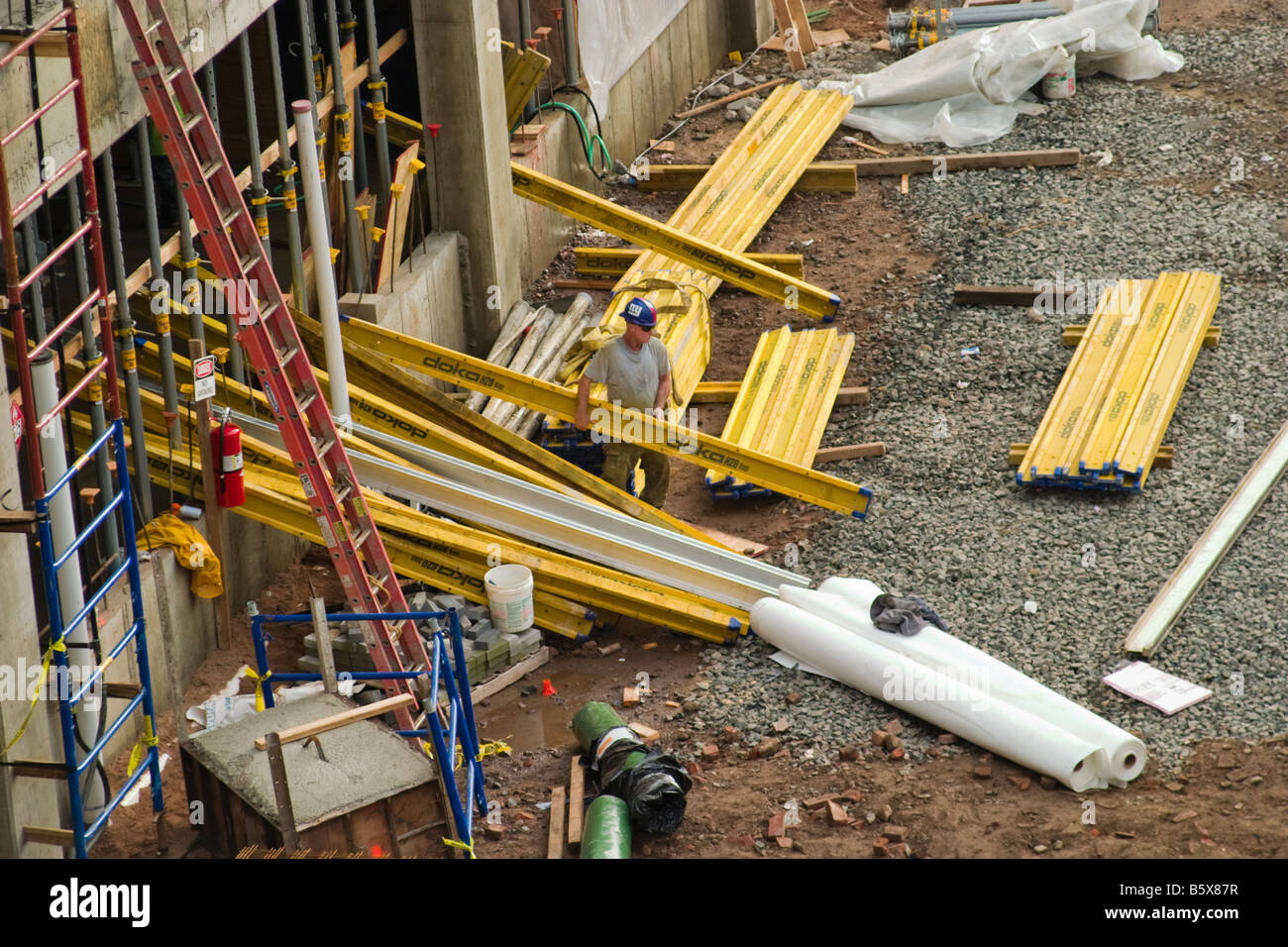 Worker at a construction site Stock Photo - Alamy