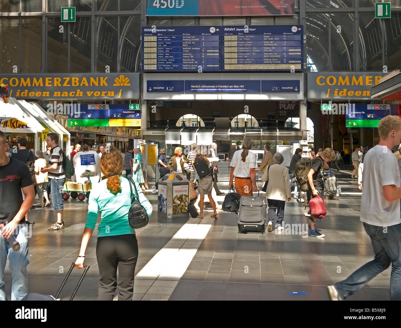 busy passangers with luggage baggage hurrying to train platform at the