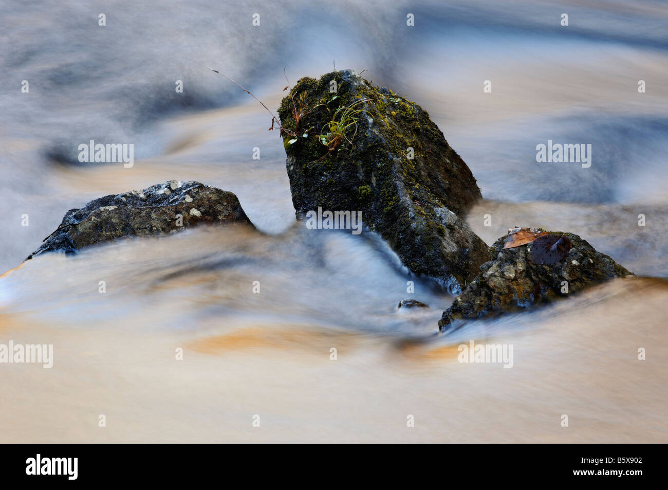 Abstract of Flowing Water Autumn Color Reflections and Boulders on the Little River Great Smoky Mountains National Park Stock Photo