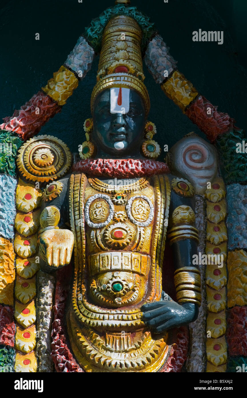 Hindu deity, Lord Venkateswara, painted statue, on the Lord Lakshmi Narasimha Swamy Temple in Kadiri, Andhra Pradesh, India Stock Photo