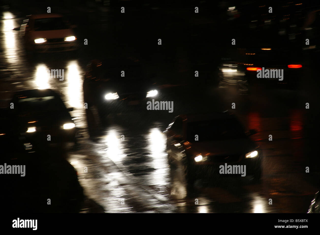 fast car driving in heavy rain at night in town Stock Photo - Alamy