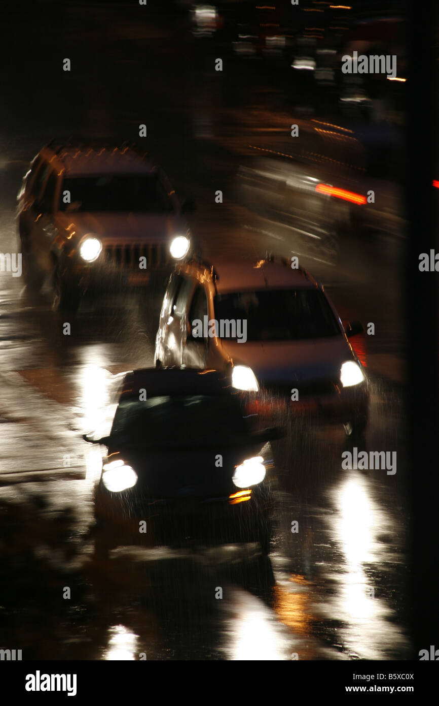 fast car driving in heavy rain at night in town Stock Photo - Alamy