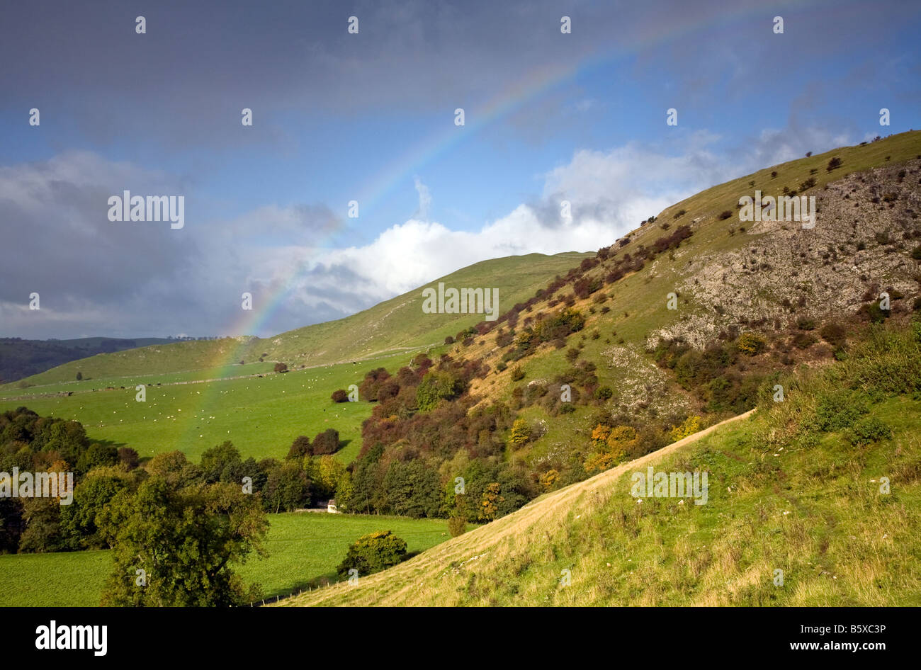 Rainbow over the Derbyshire Hills in Dovedale Stock Photo