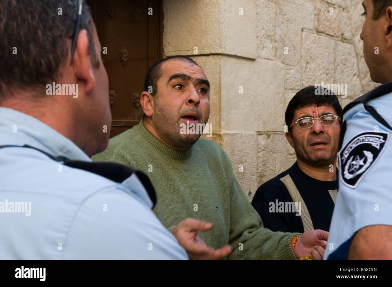Israel Jerusalem Old city argument between palestinian hawker and israeli policeman Stock Photo