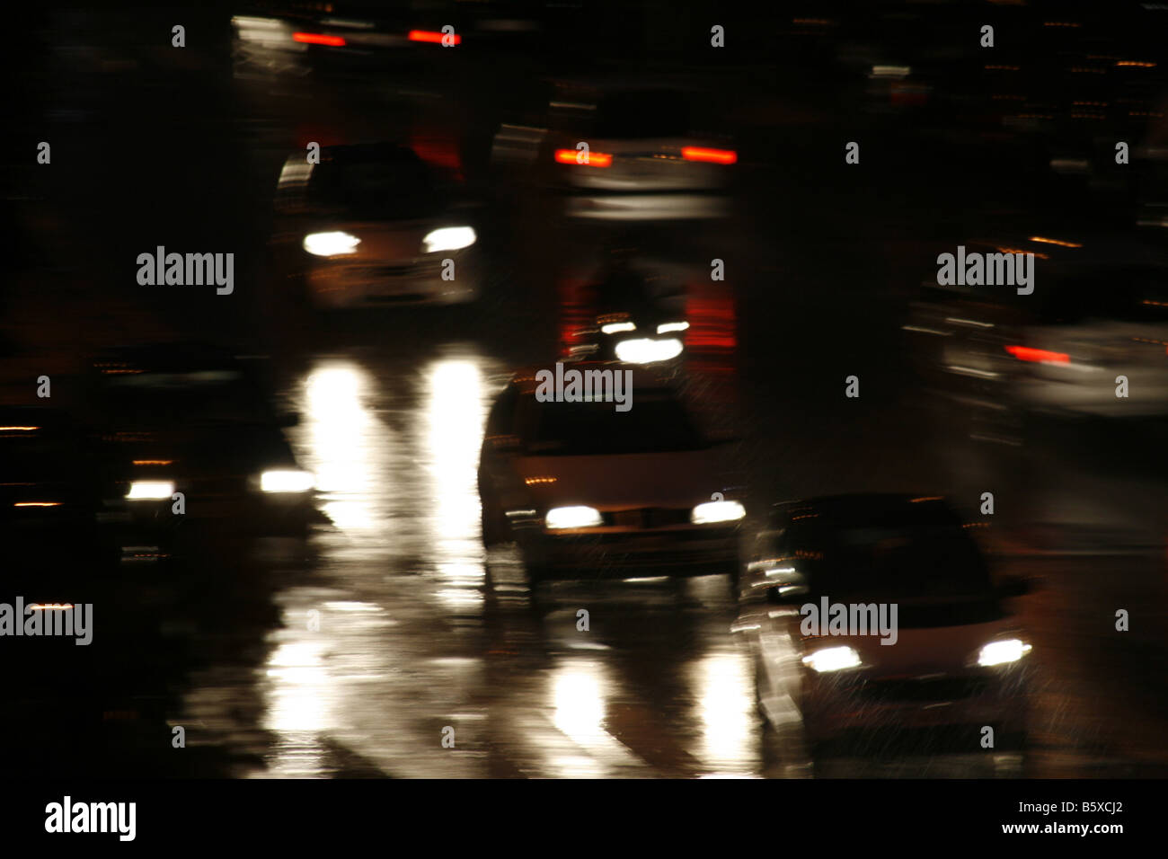 fast car driving in heavy rain at night in town Stock Photo - Alamy
