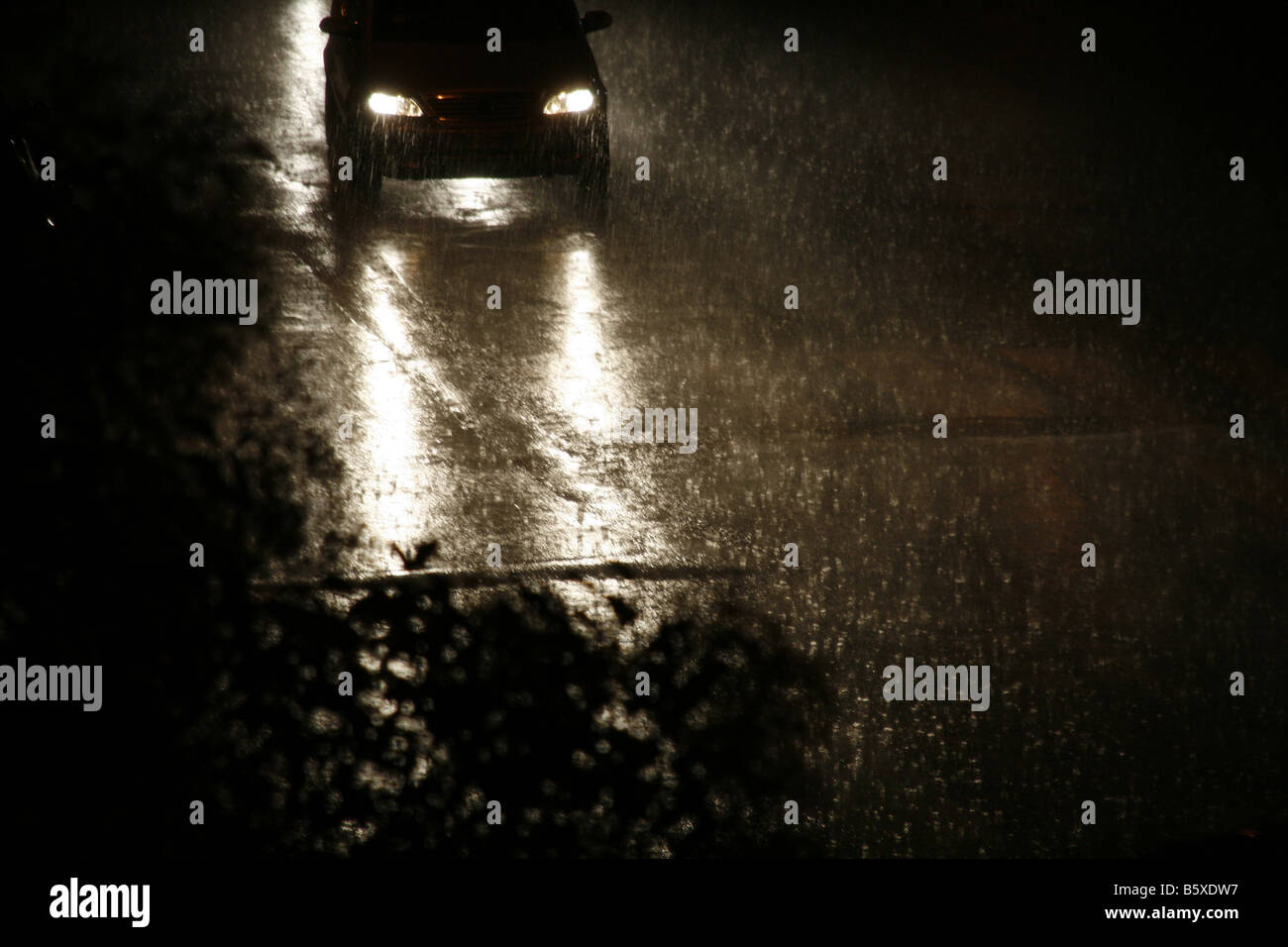 fast car driving in heavy rain at night in town Stock Photo Alamy