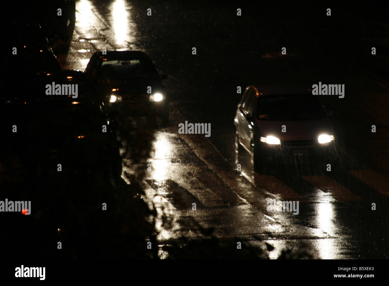 fast car driving in heavy rain at night in town Stock Photo - Alamy