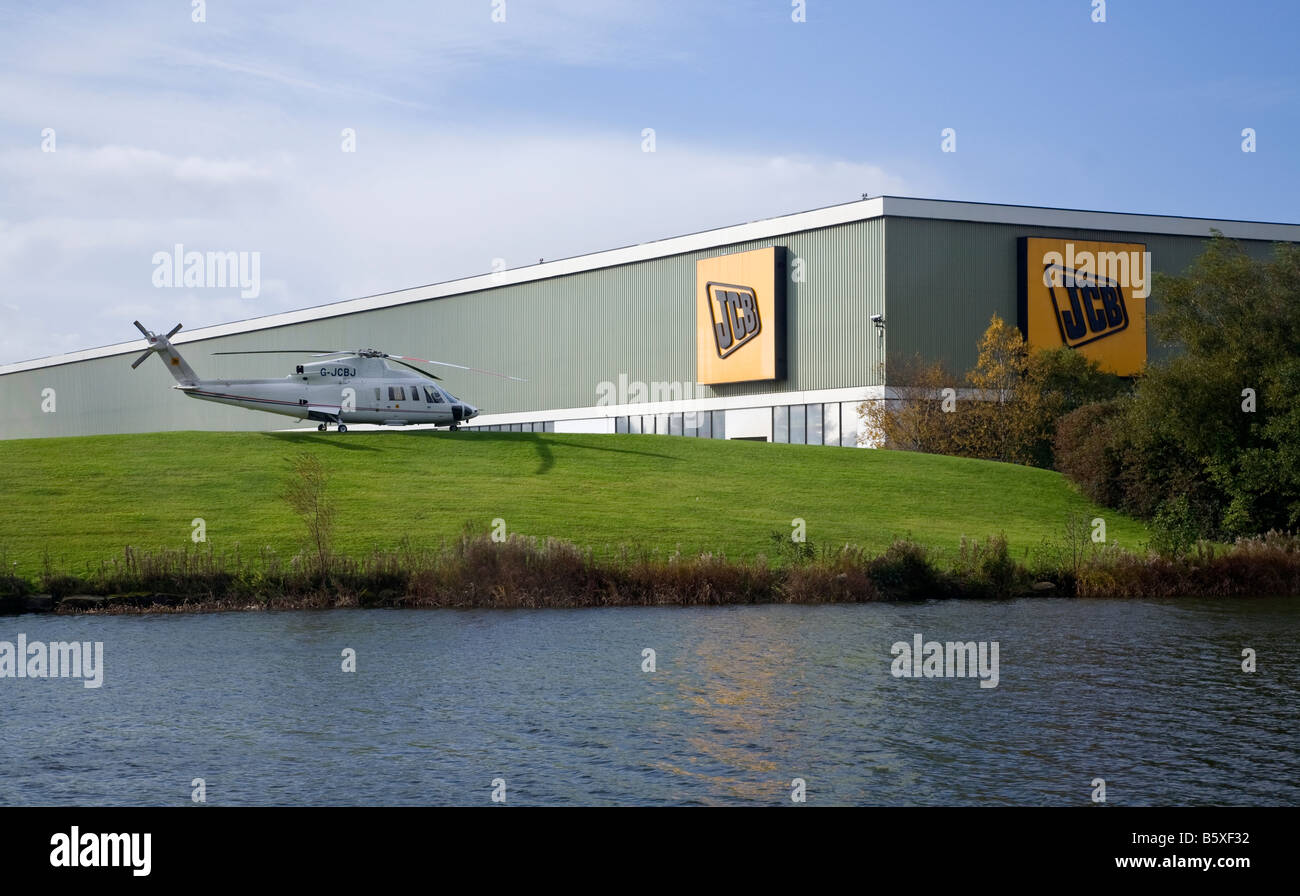 JCB Landscaped grounds with lake at Rocester Stock Photo Alamy