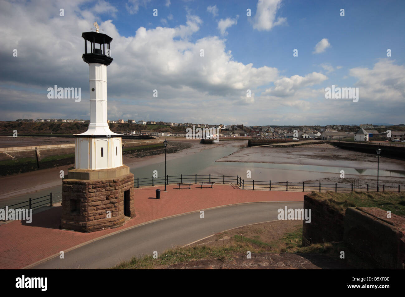 A view of Maryport harbour and lighthouse from the coast Stock Photo