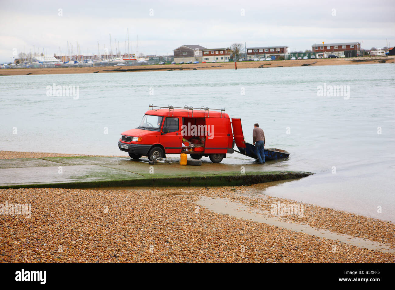 Recovering a dinghy on the slipway at Hayling Island Stock Photo
