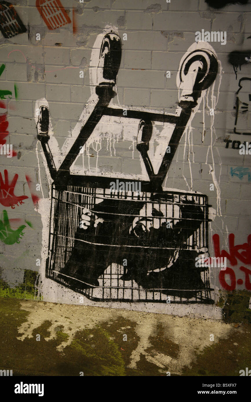 shopping trolley trapped prison Banksy graffiti artist art Stock Photo -  Alamy