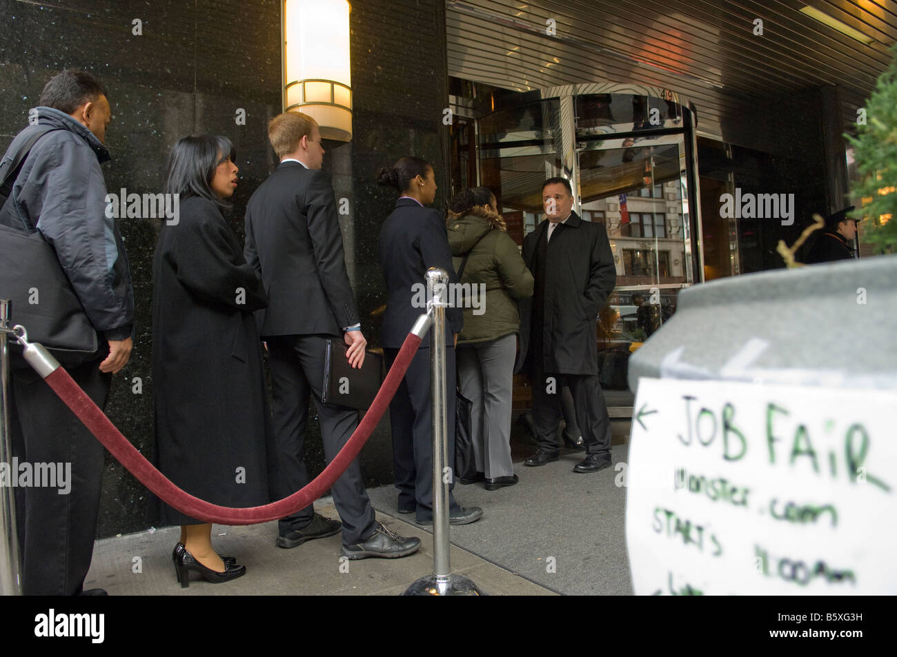 Hundreds of people line up in New York at a job fair sponsored by the website Monster com Stock Photo