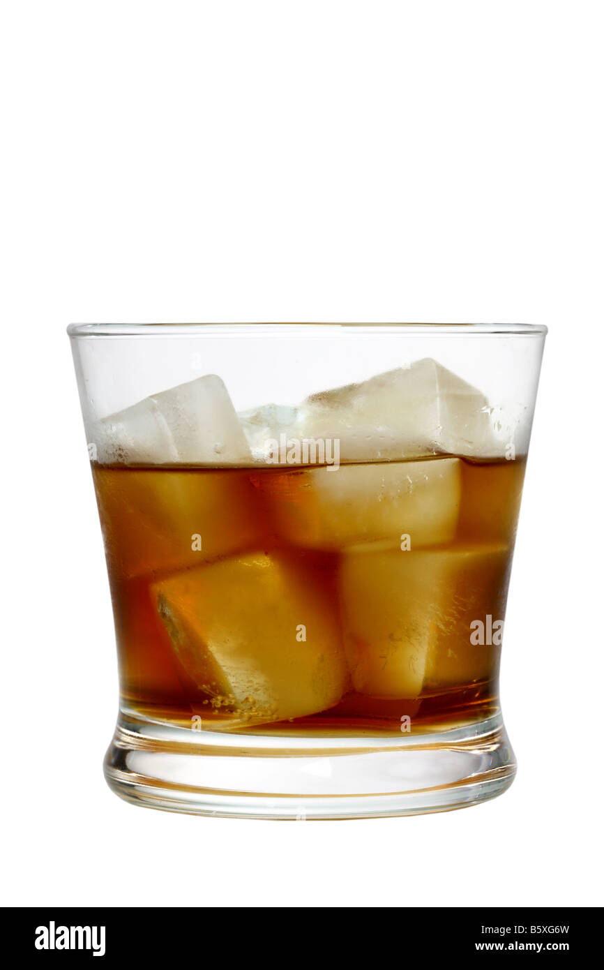Glass of liquor with ice cutout isolated on white background Stock Photo