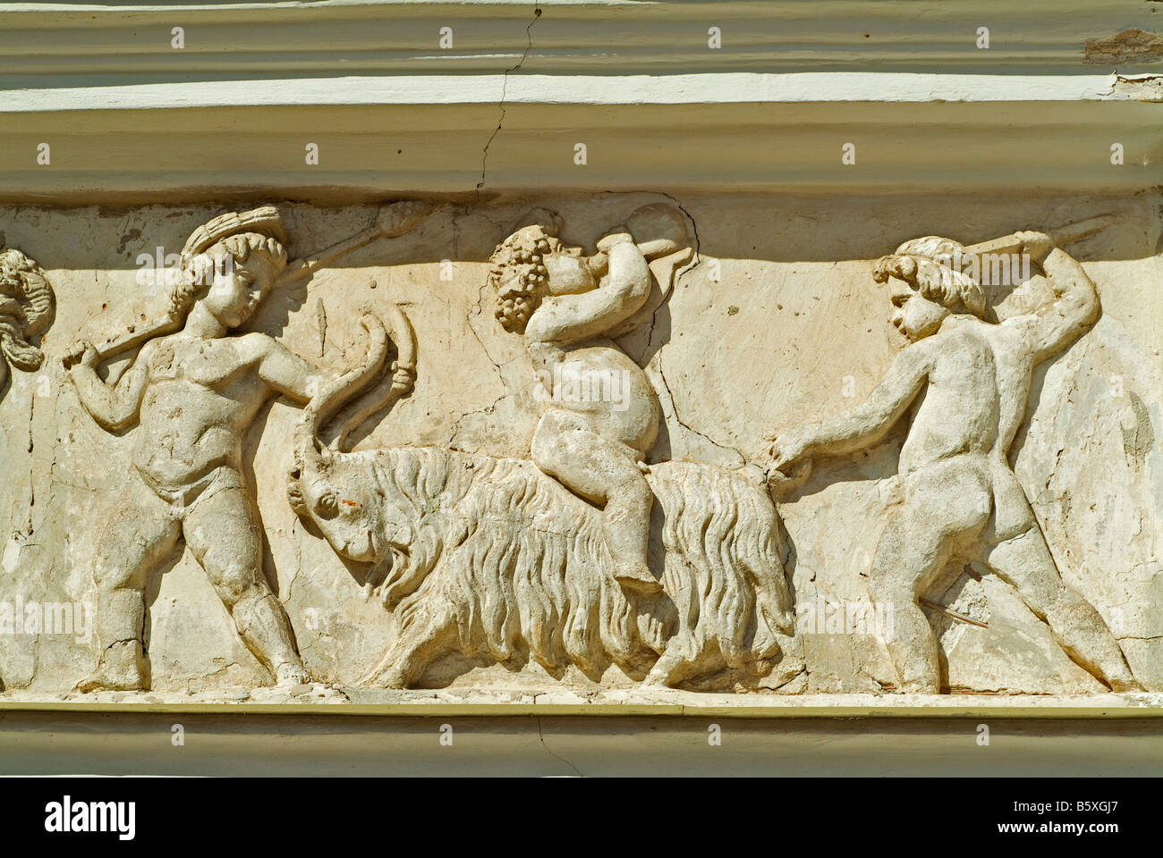 relief with a scene with putto putti fighting with a ram on the wall of the classicist castle in Paezeriai near Vilkaviskis Stock Photo