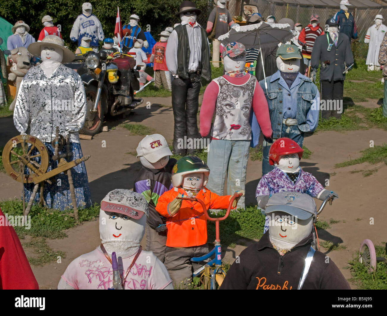 lots of dressed dolls in garden in differenz scenes special attraction in the village Sabile Latvia Baltic states Stock Photo