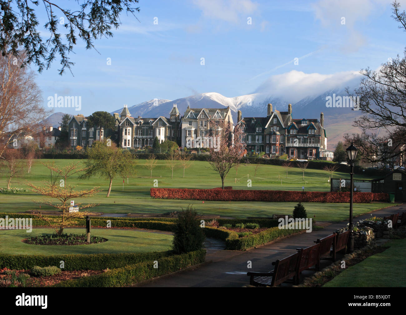 A view across Hope Park in Keswick looking towards a snow capped Skiddaw, Cumbria, England, UK Stock Photo