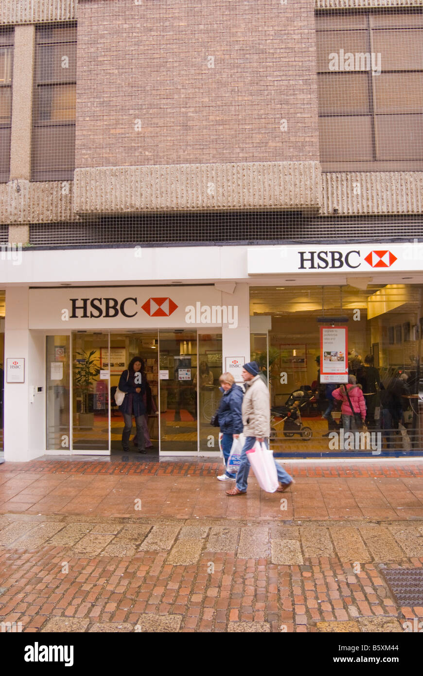 Entrance to HSBC bank with people coming out in the city centre of Norwich,Norfolk,Uk Stock Photo