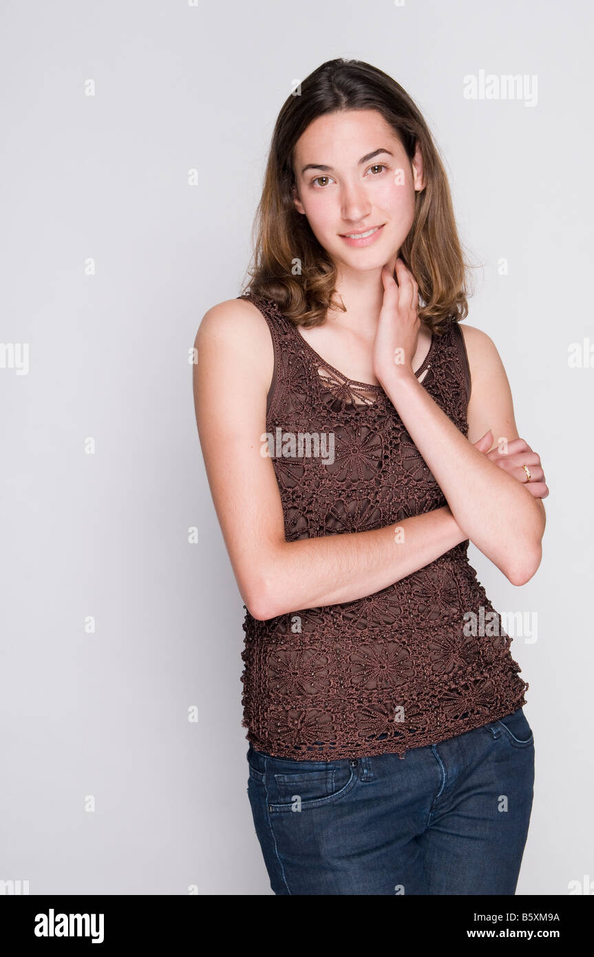 Portrait of a smiling young brunette woman Stock Photo - Alamy