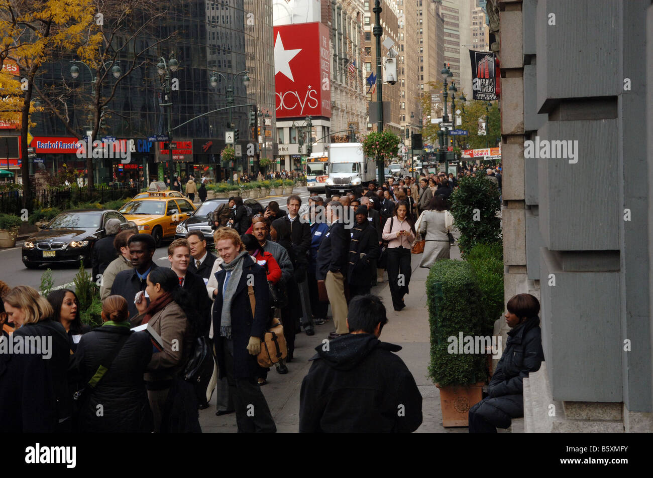 Hundreds of people line up in New York at a job fair sponsored by the website Monster com Stock Photo