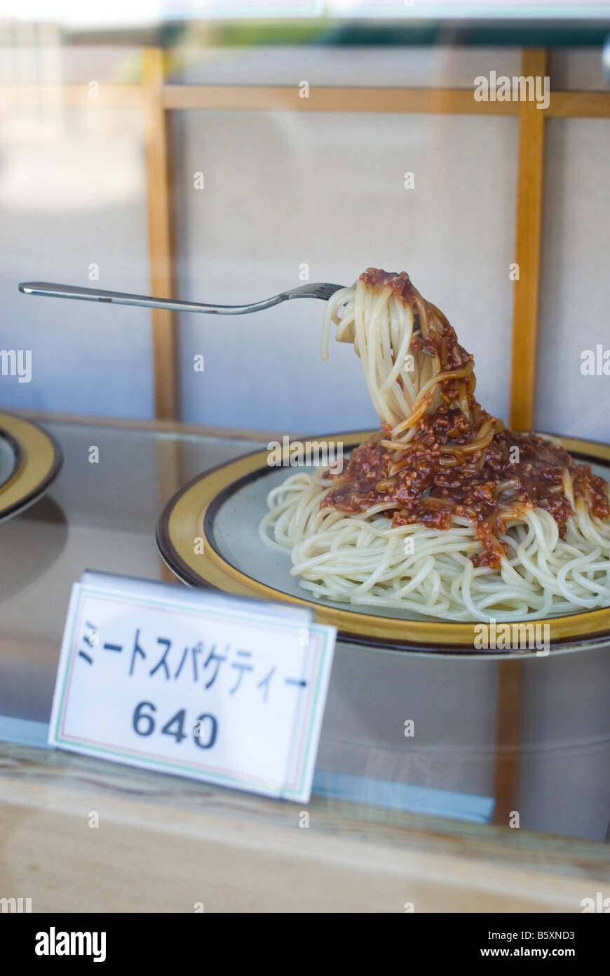 Plastic food replica in a restaurant window hires stock photography