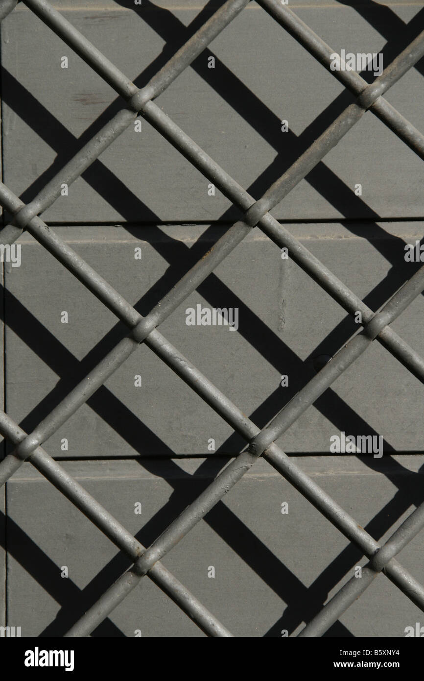 security barrier metal bars on outside door in sun Stock Photo Alamy