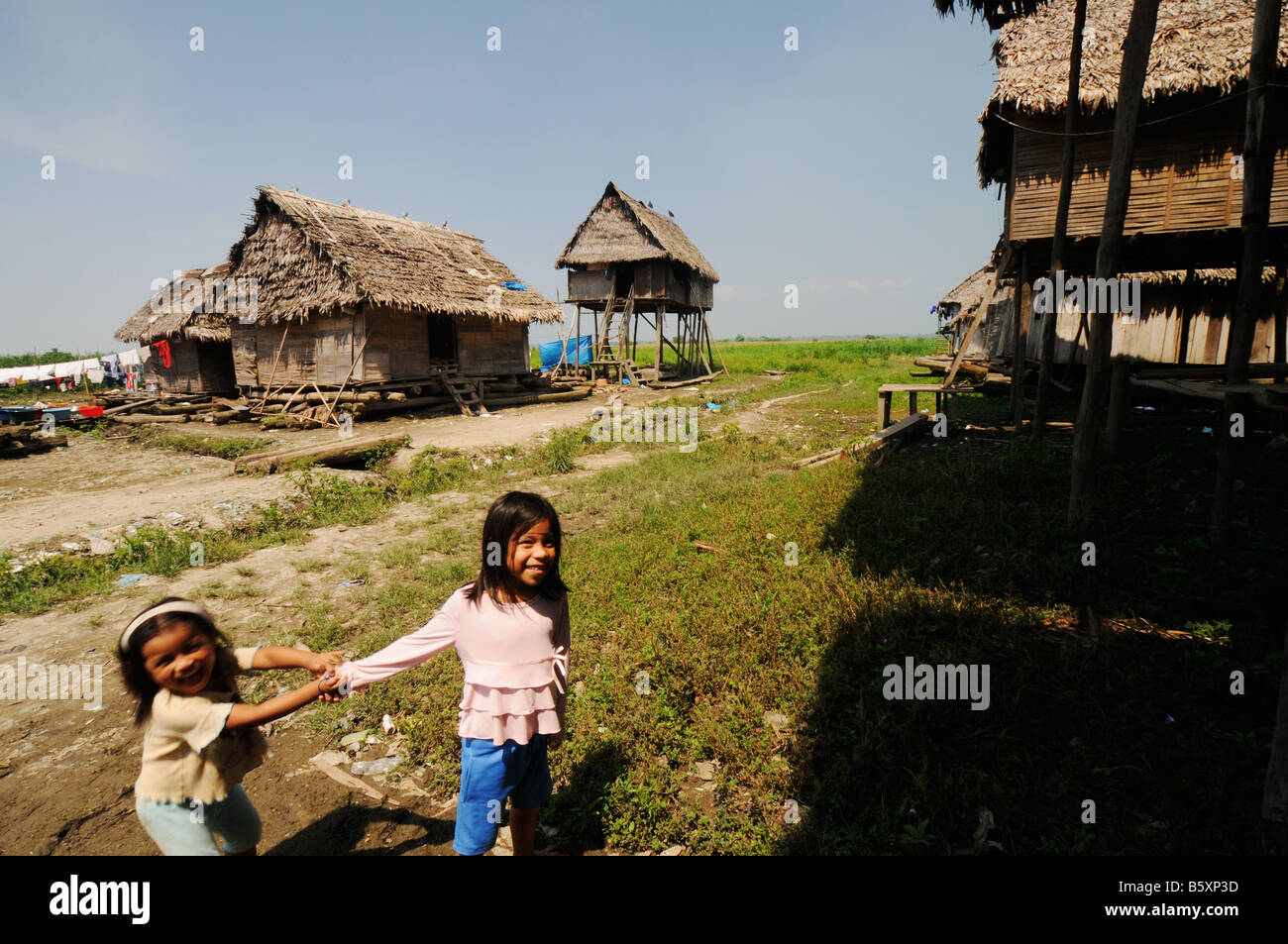Two mestizo girls play in the neighborhood of Belen, located in Iquitos in Peru´s Amazon region. Stock Photo