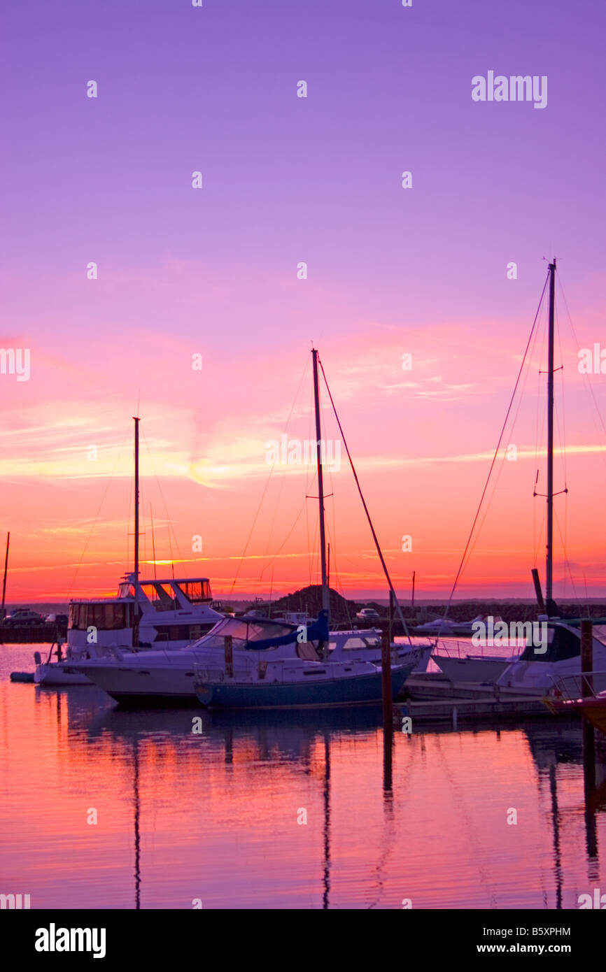 Sailboats at sunset, Pointe Du Chene, New Brunswick, Canada Stock Photo