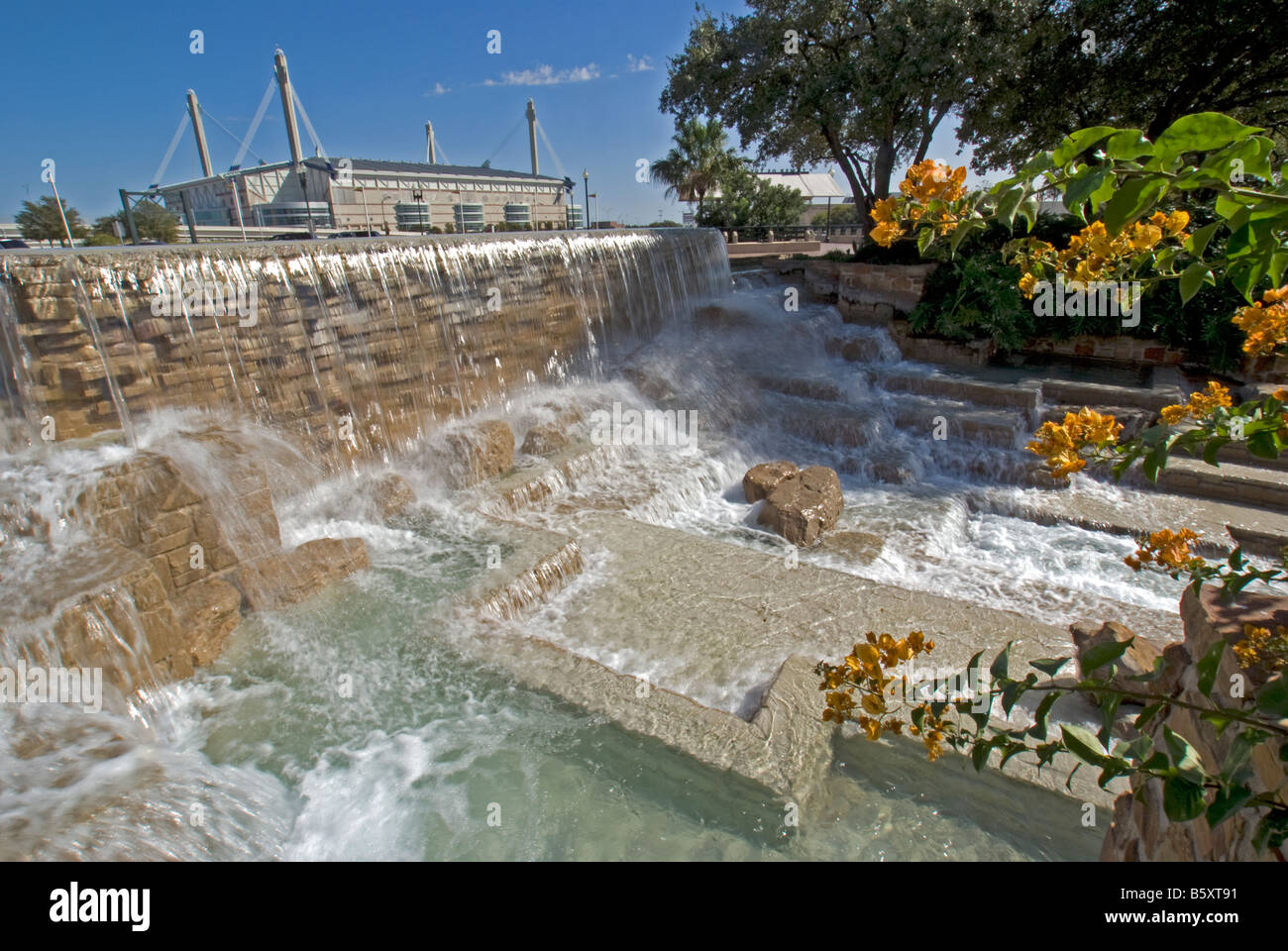 San Antonio's HemisFair Park, water fall fountain with Alamodome in