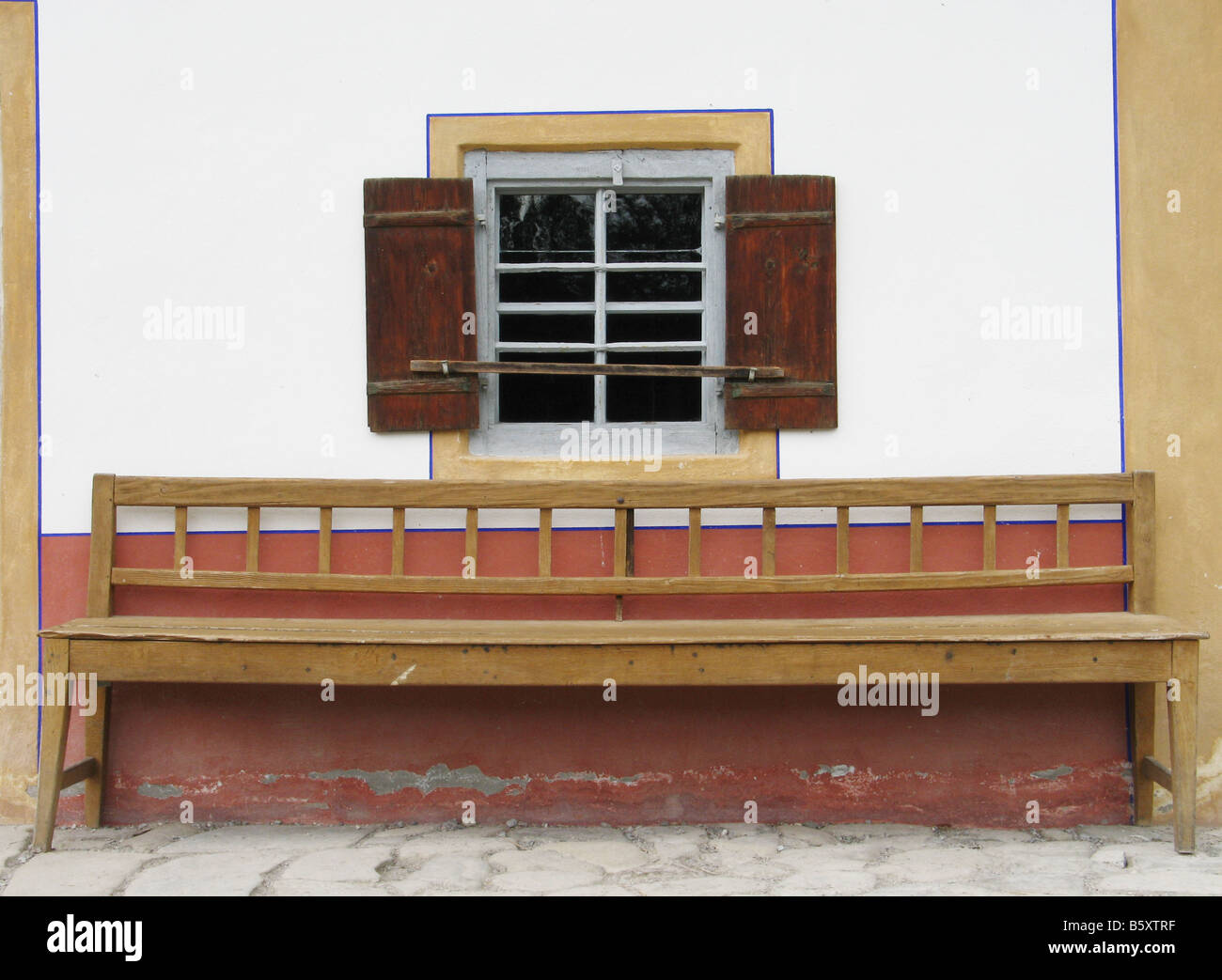 bench in front of a window of an old bavarian farmstead Stock Photo - Alamy