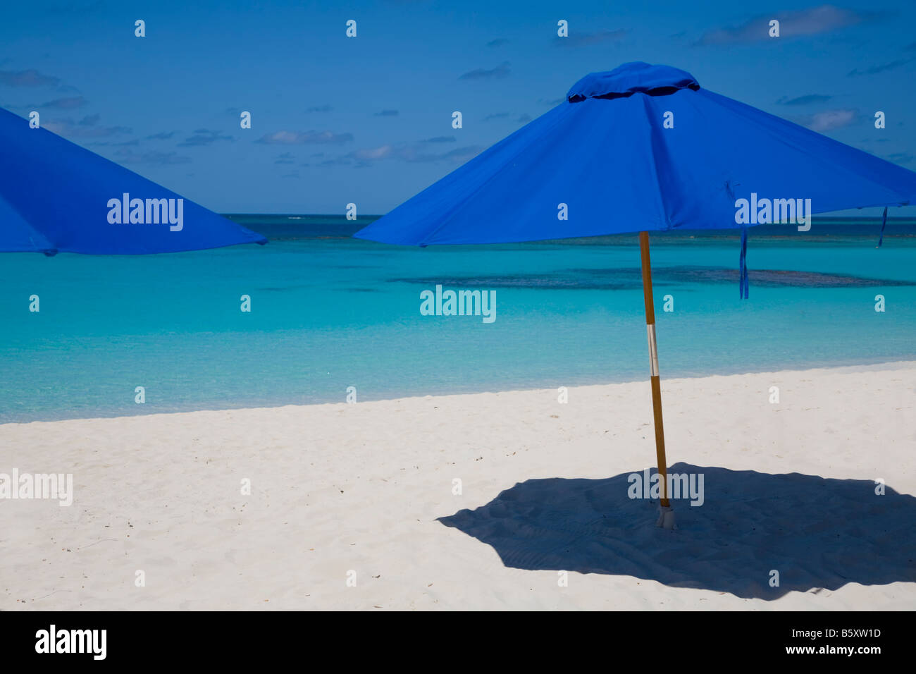 Umbellas on Shoal Bay East Beach on the caribbean island of Anguilla in the British West Indies Stock Photo