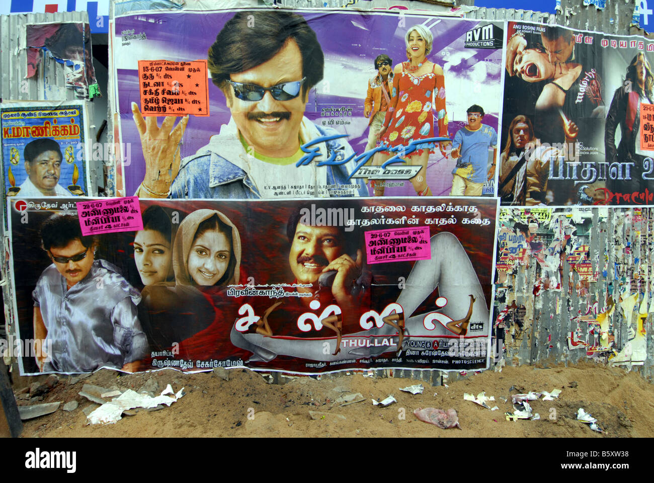 FILM POSTERS PASTED ON THE WALL IN MADURAI TAMILNADU Stock Photo