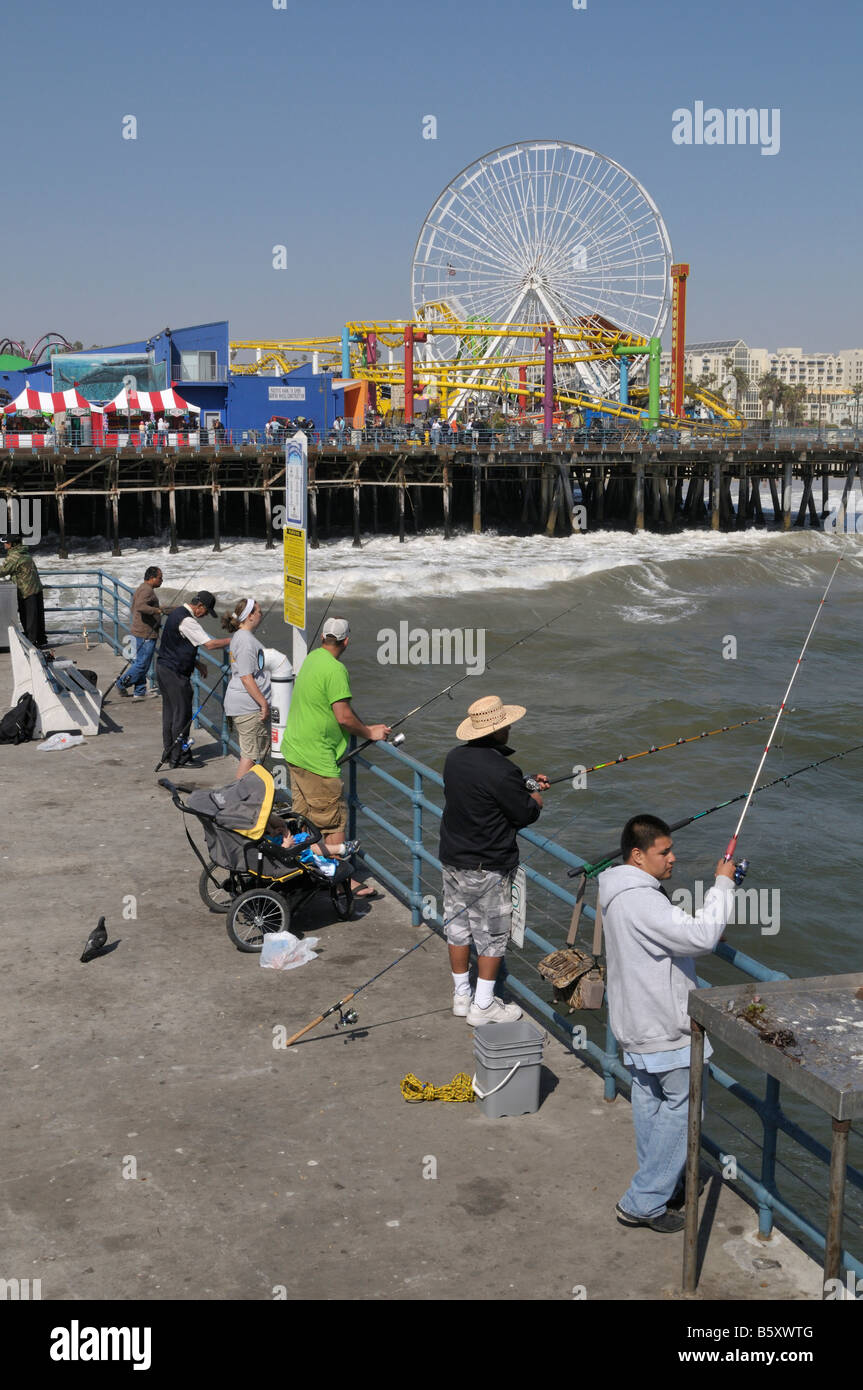 Fisherman trying to catch something from the Santa Monica Pier Stock Photo  - Alamy