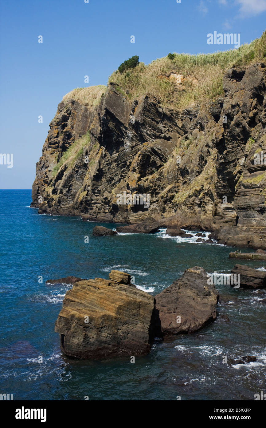 Rocks at the sea by the fishing harbour, porto de pesca, Capelas, São Miguel, Azores Stock Photo