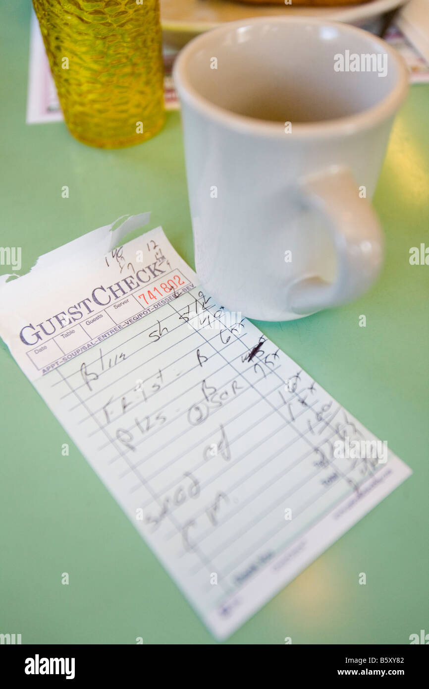 An inside view of an American Diner and the check for the breakfast meal. Stock Photo