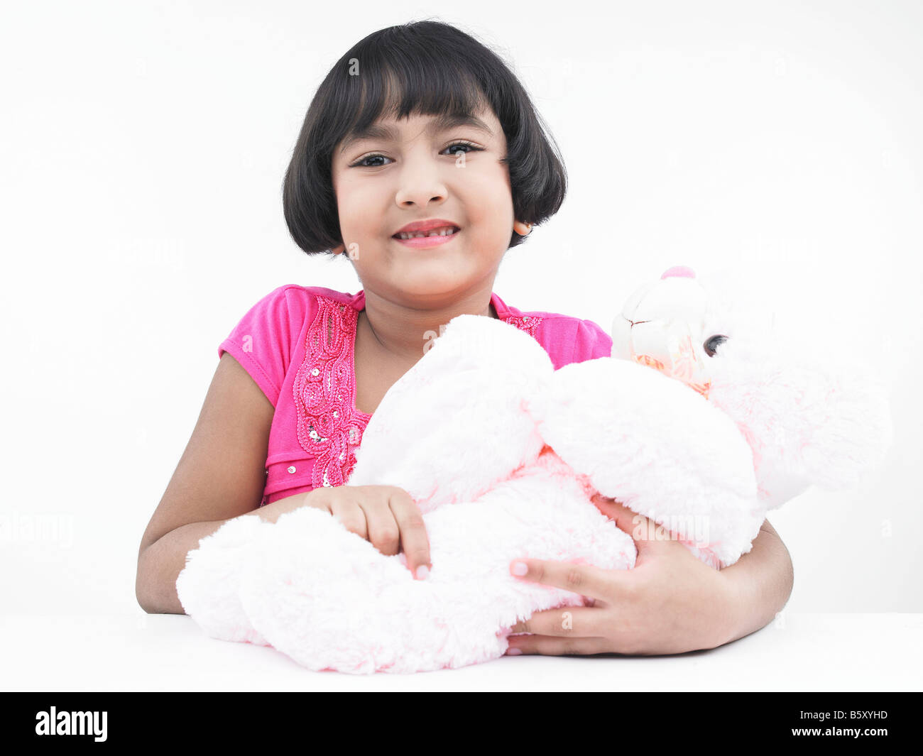 a pretty asian girl with her teddy bear Stock Photo - Alamy