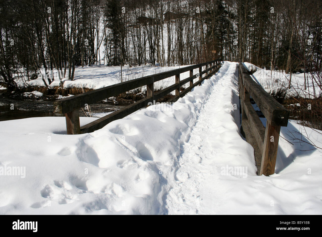 Snow covered bridge crossing river hi-res stock photography and images ...