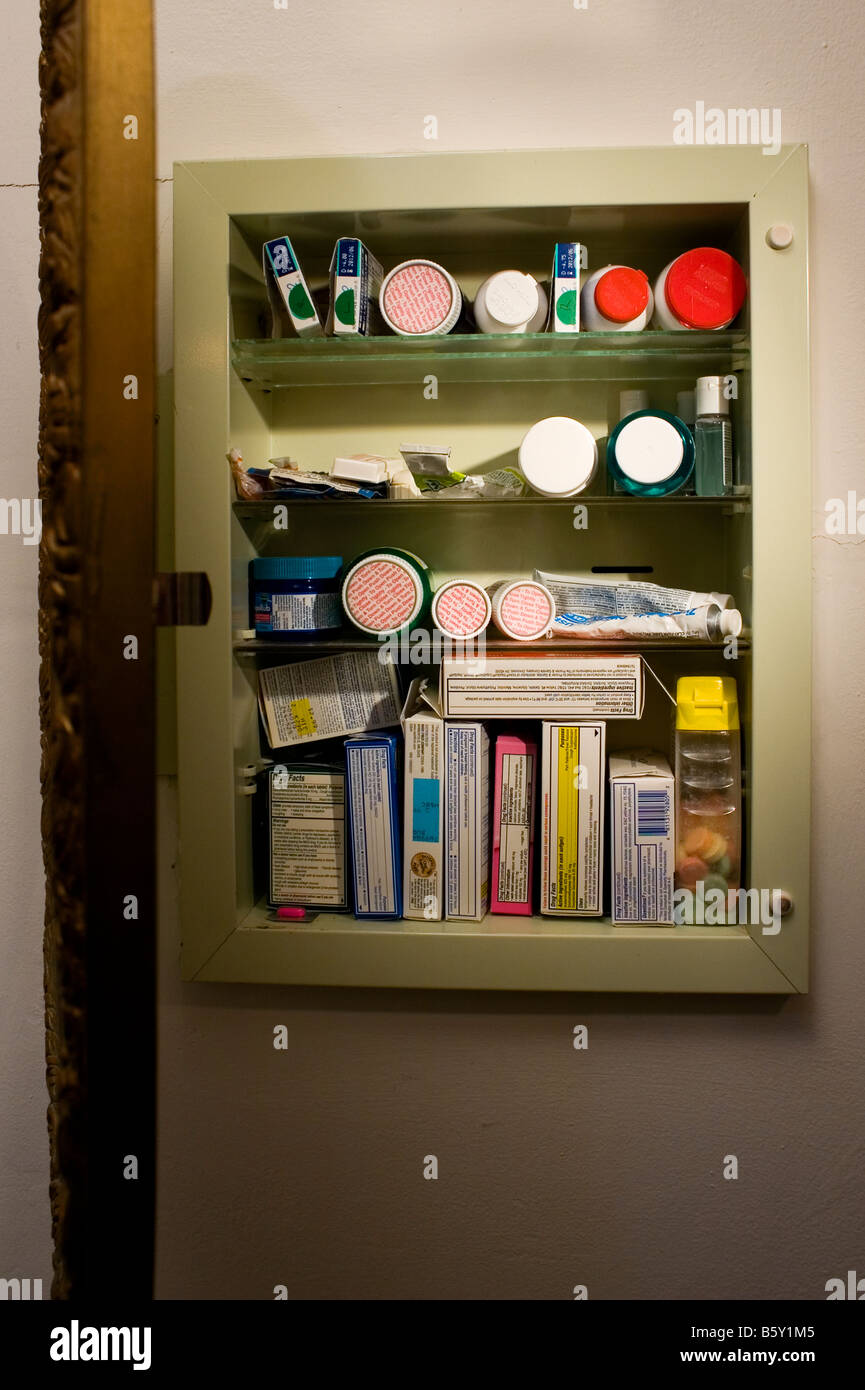 A Medicine Cabinet Is Open Showing Both Prescription And Over The