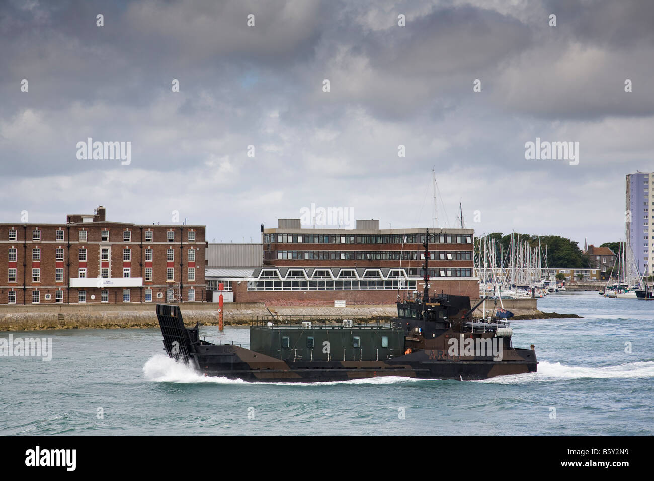An army landing craft prepares to leave Portsmouth Harbour, Hampshire, England. Stock Photo