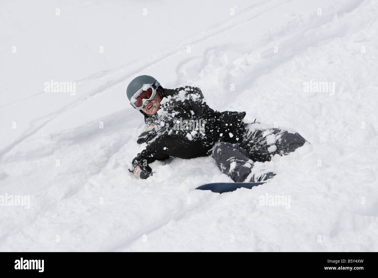 person crashes while skiing in Whistler BC Stock Photo