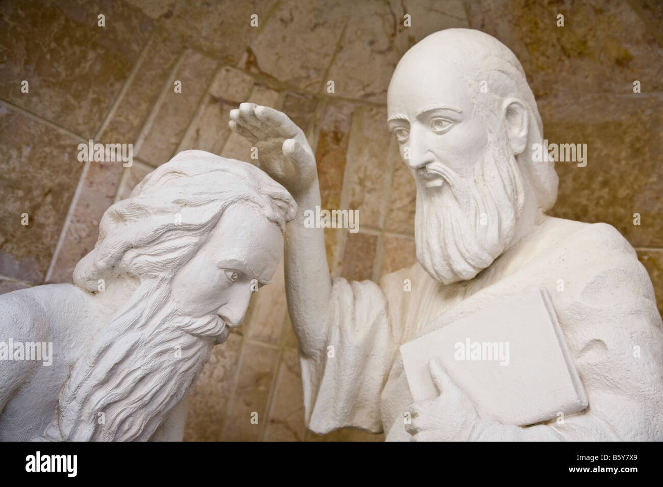 Statue of Ananias baptising Paul in the court yard of St Ananias. Old