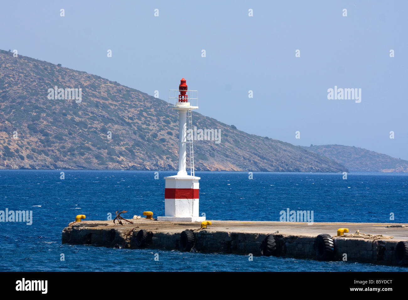 Greece Crete red light tower at the entrance to a harbour The red light