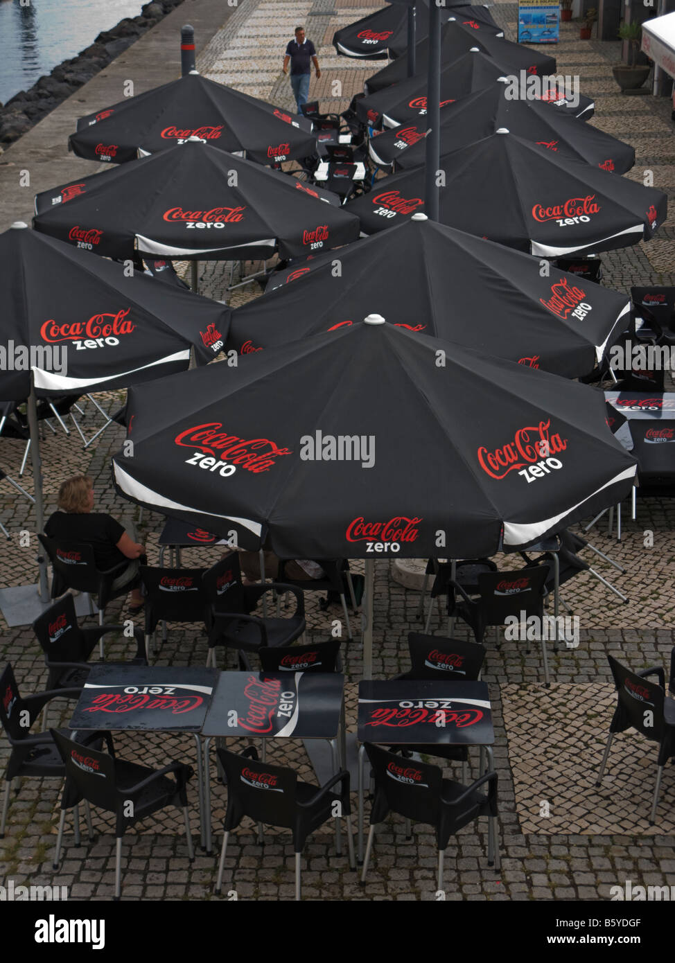 Coca Cola parasols at a bar by the marina in Ponta Delgada, Azores, Portugal Stock Photo