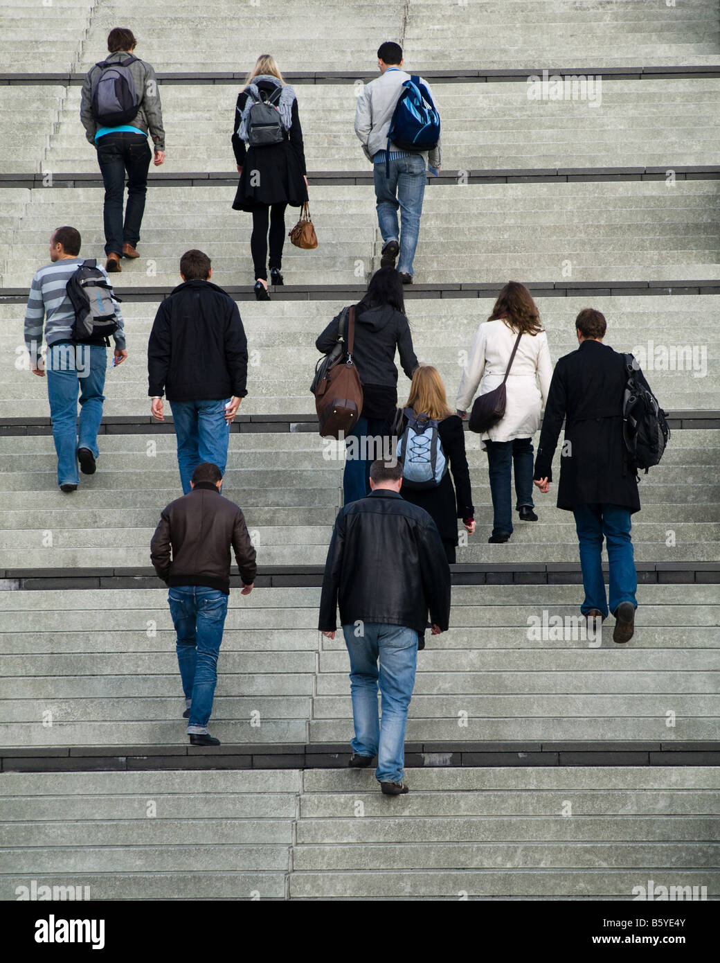 Group of friends climbing stairs Stock Photo