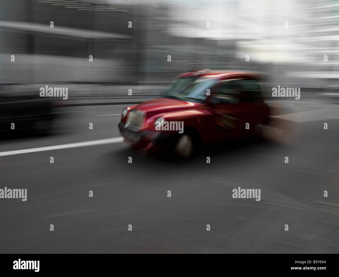 Red cab in London defocused motion blur Stock Photo