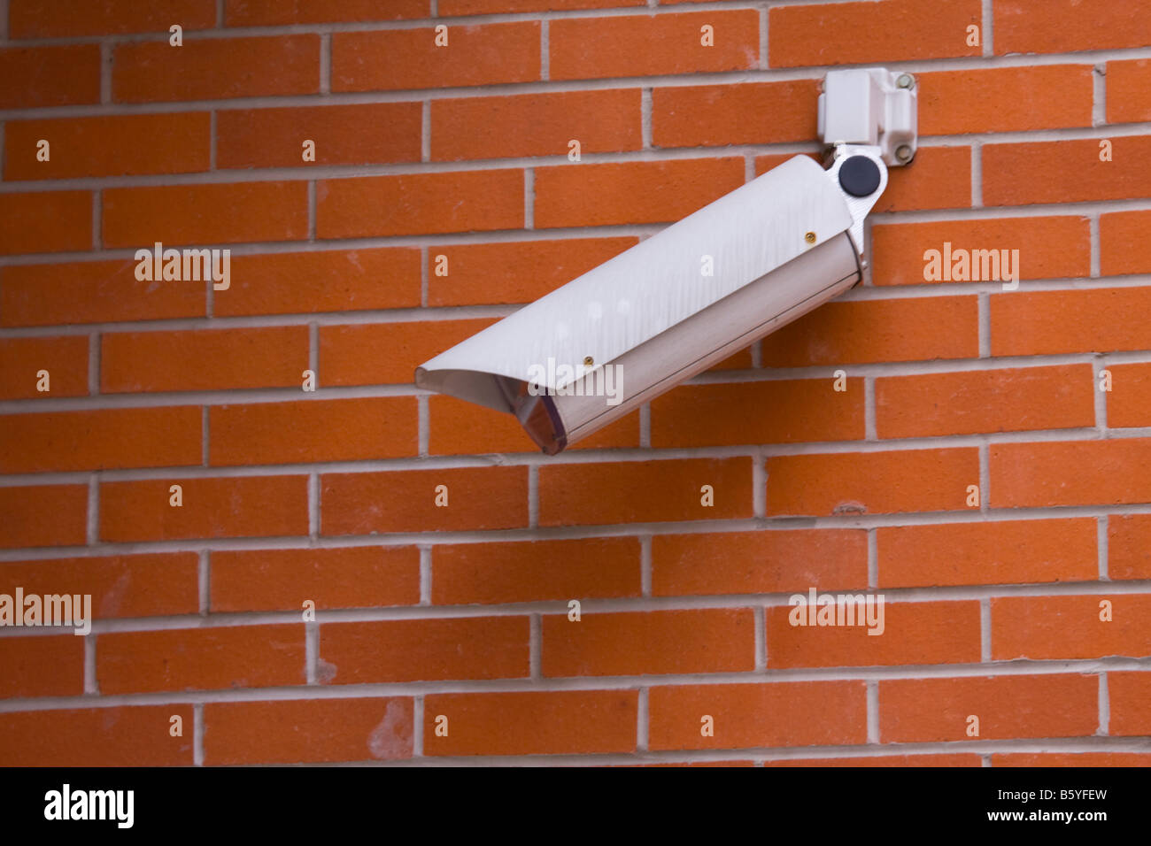 mounting security camera on brick wall