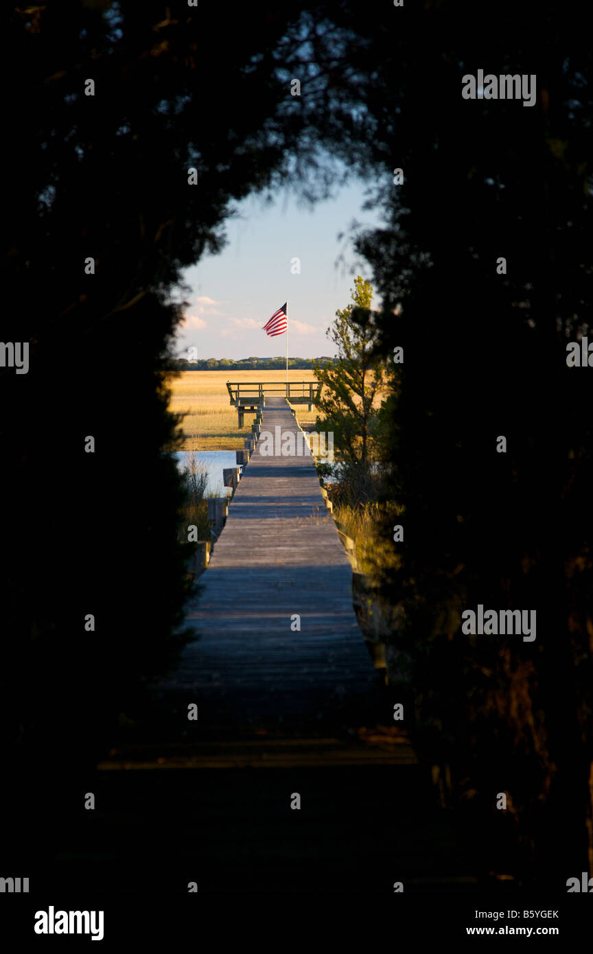 View down the dock in a saltwater marsh along the coast of South Carolina near Charleston Stock Photo