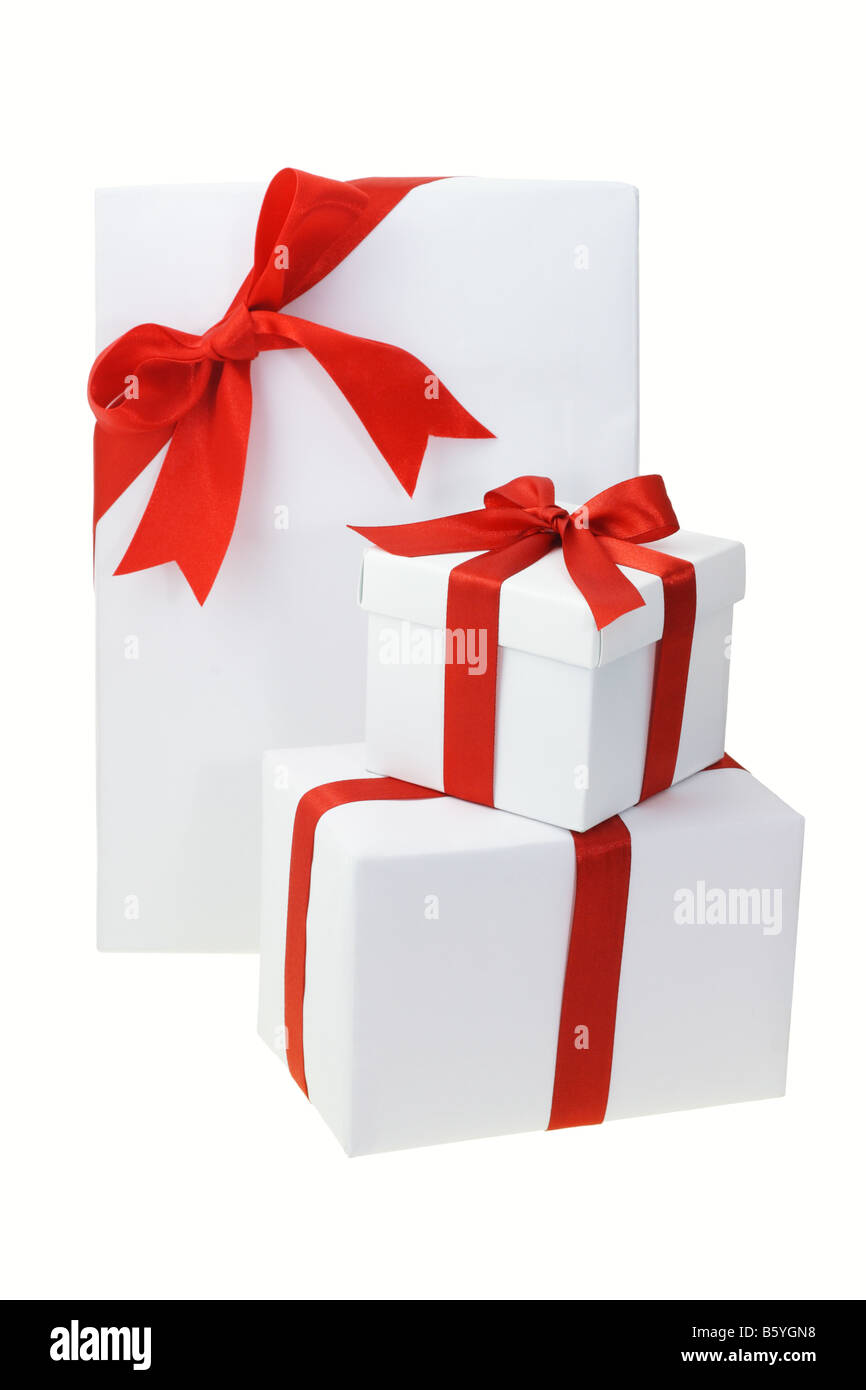 Three white gift boxes with red bow ribbons on white Stock Photo - Alamy